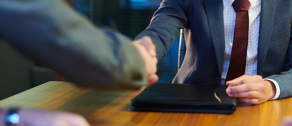 Job applicant shaking hands with hiring manager